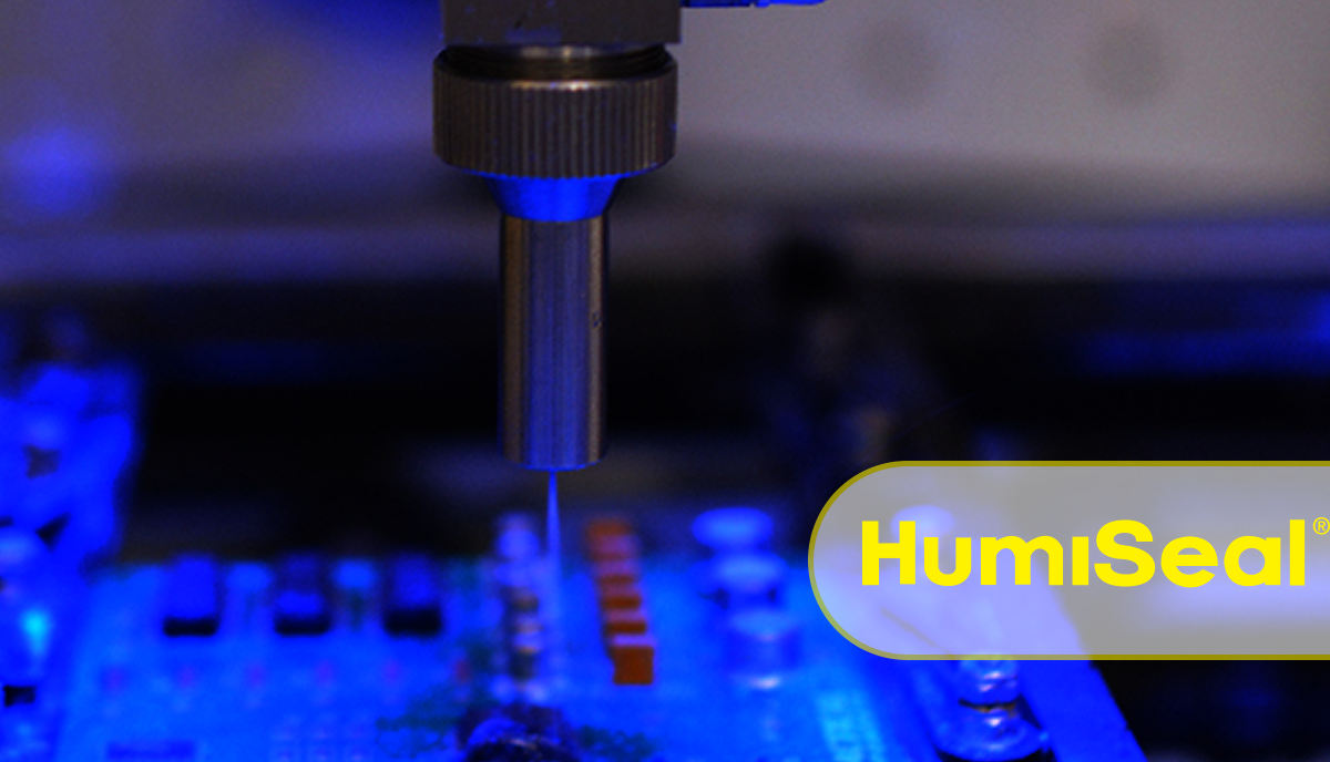 Conformal coating being sprayed on a printed circuit board