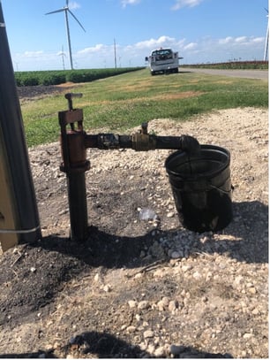 Figure 3. Casing Fill Hook-Up Equipment With 5-Gallon Bucket